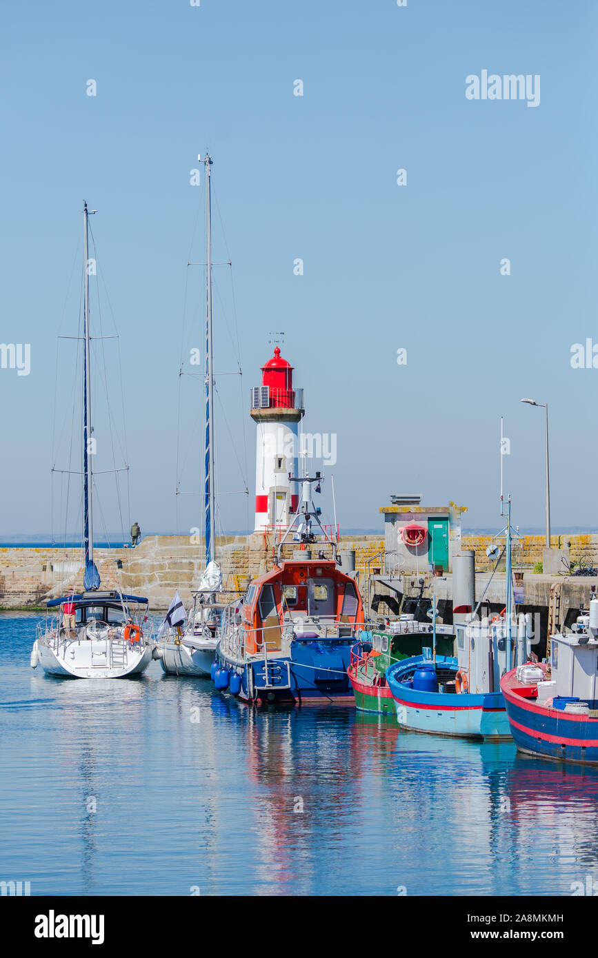 Brittany, ile de Groix, harbor Port-Tudy, red lighthouse and boats Stock Photo