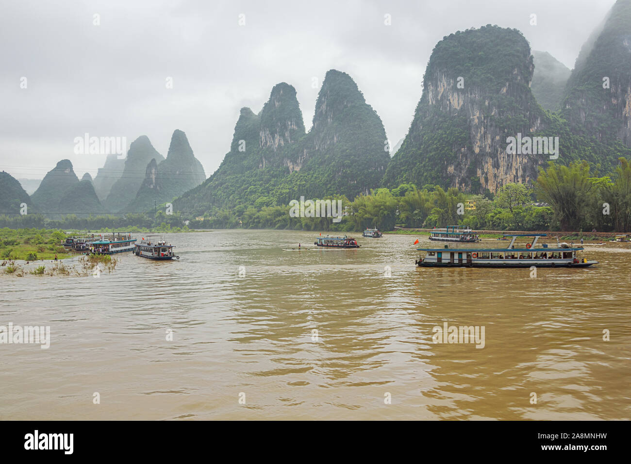 Editorial: GUILIN, GUANGXI, CHINA, April 19, 2019 - Busy boat traffic at Maozhou island in the vicinity of Lingchuan near Guilin Stock Photo