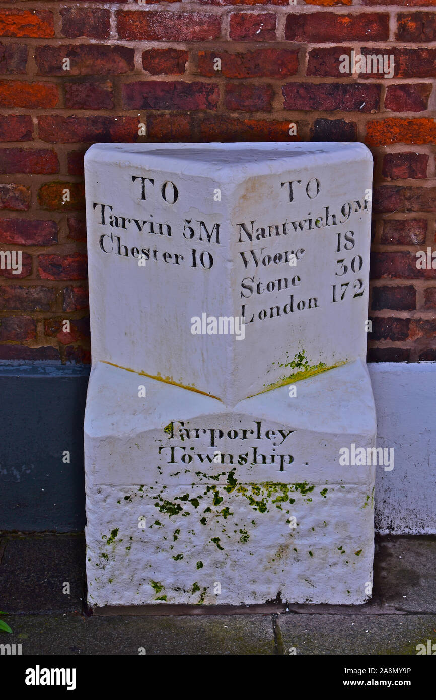 An ancient milestone in the village of Tarporley on the A51 such as Nantwich, Woore and Stone, the route eventually ending in London 172 miles away. Stock Photo