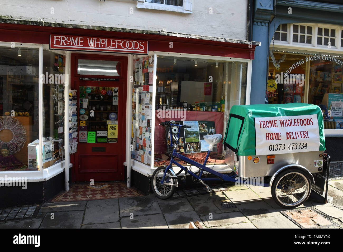 Eco friendly delivery vehicle outside the wholefood shop in Cheap street, Frome, Somerset. Small