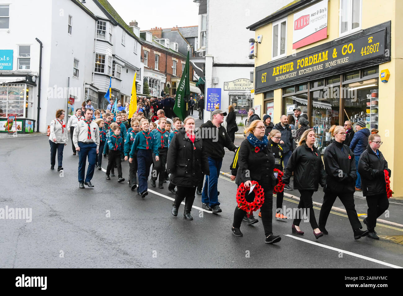 Lyme Regis, Dorset, UK.  10th November 2019.  Remembrance Sunday parade along Broad Street at Lyme Regis in Dorset.  Picture Credit: Graham Hunt/Alamy Live News Stock Photo