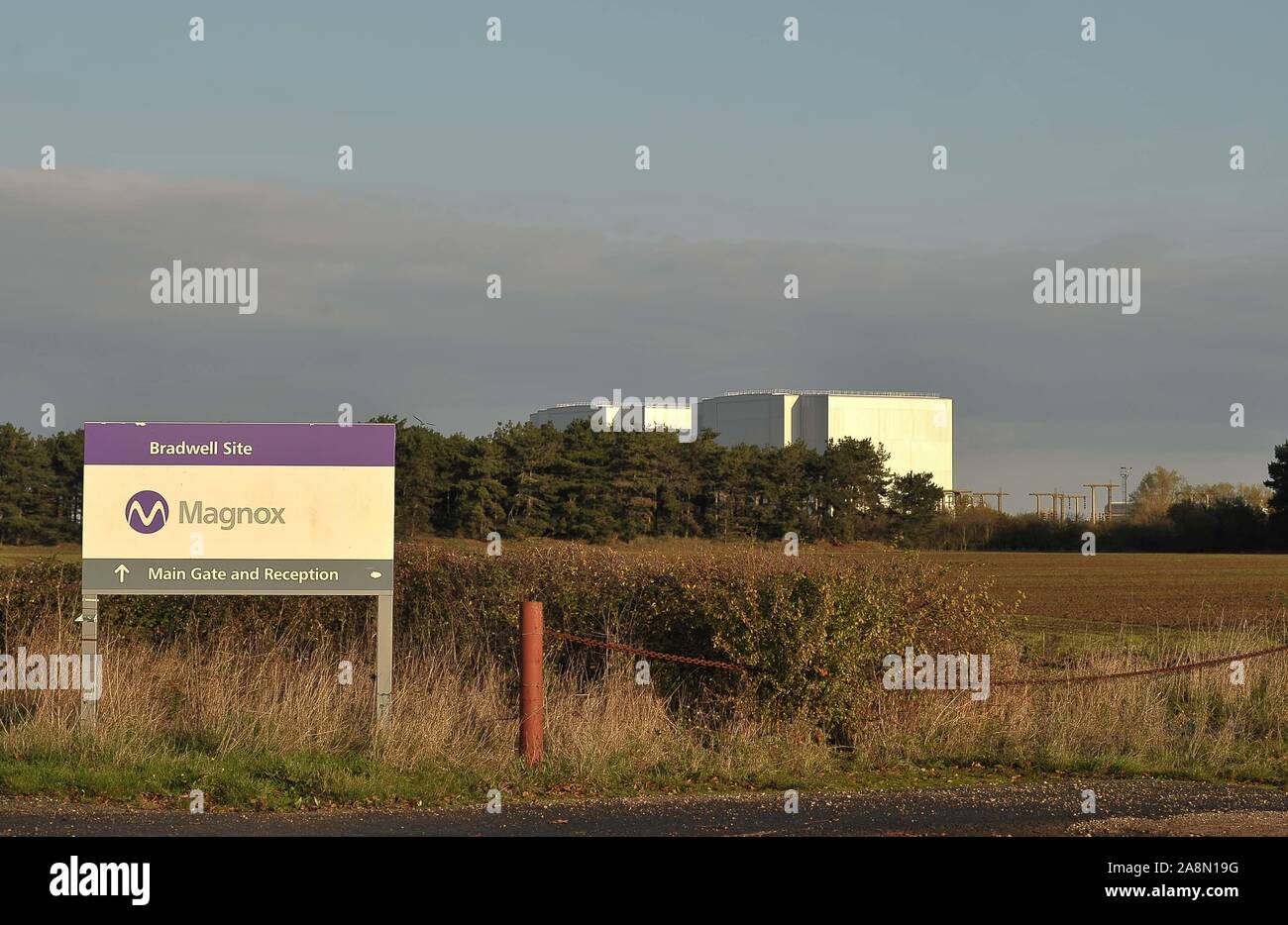 Bradwell. United Kingdom. 10 November 2019. The signs at the entrance road to the Bradwell nuclear power station, with the power station in the background. Around  Bradwell. Essex. United Kingdom. Credit Garry Bowden/Sport in Pictures. Stock Photo