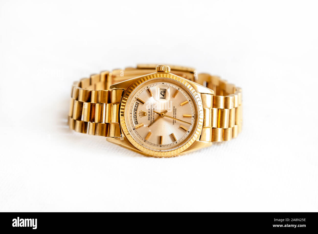 CREMONA, ITALY - MARCH, 2019: Rolex Oyster Perpetual Day- Date watch on white background. Rolex SA is an important Swiss luxury company in the product Stock Photo