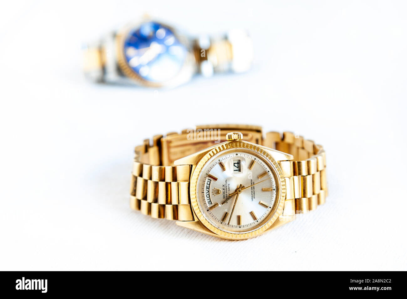CREMONA, ITALY - MARCH, 2019: Rolex Oyster Perpetual Day- Date watch on white background. Rolex SA is an important Swiss luxury company in the product Stock Photo