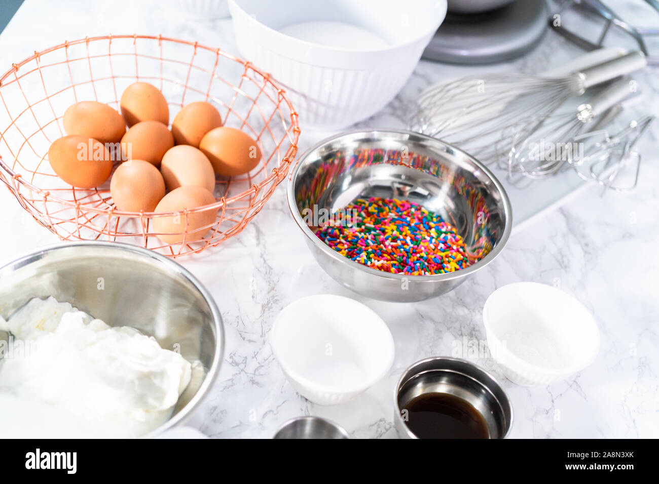Ingredients to bake funfetti cake with colorful sprinkles Stock Photo