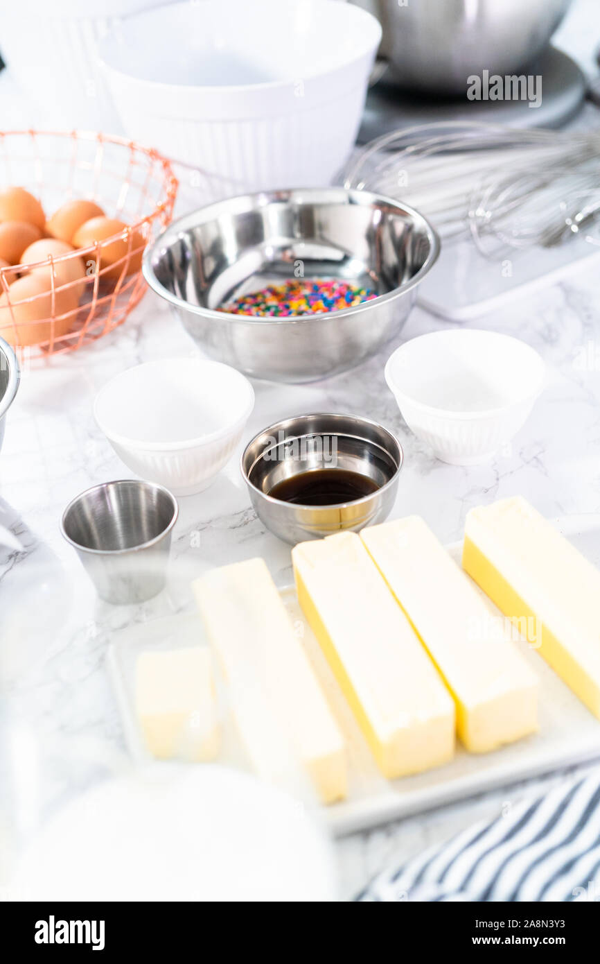 Ingredients to bake funfetti cake with colorful sprinkles Stock Photo