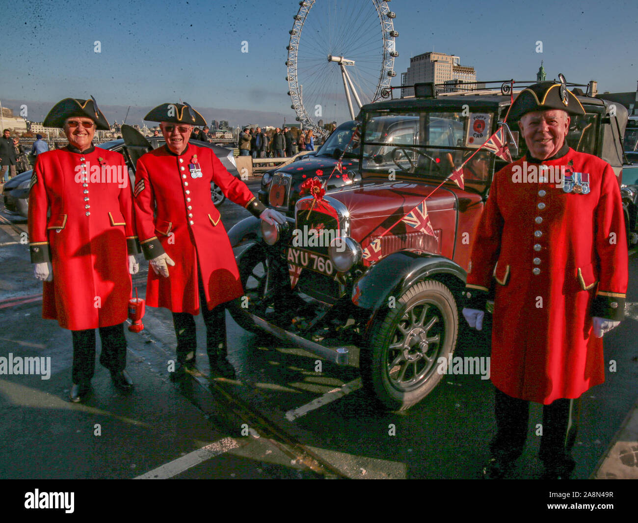 London, UK. 10 Novemb.. Three Chelsea pensioners, in Westminster Bridge
