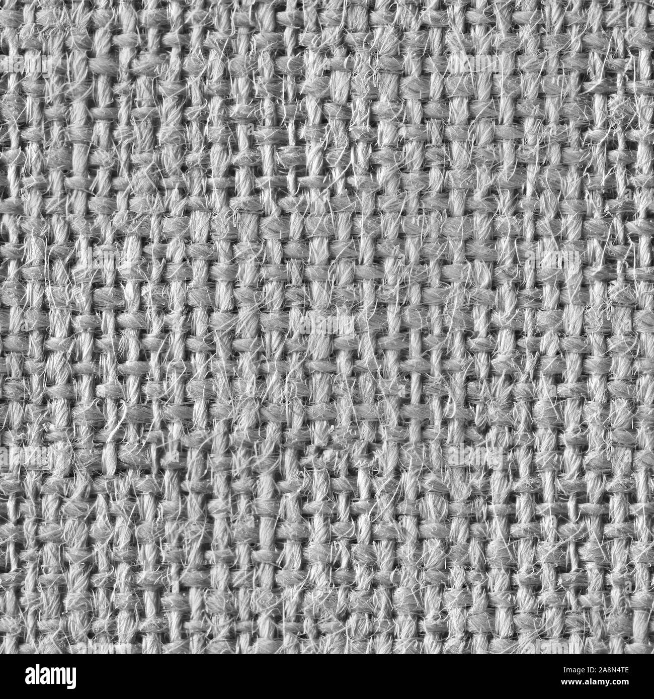 Background from gray coarse canvas close-up. Seamless square texture ...