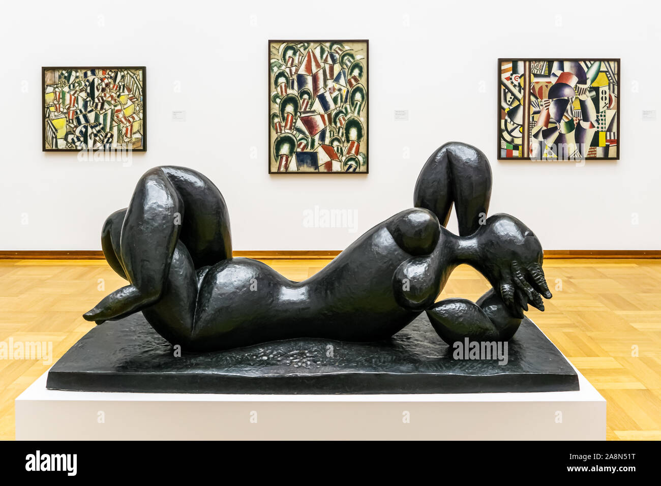 Henri Laurens The Fall sculpture and Fernand Leger paintaings in the background at Basel Art Museum, Switzeland. Stock Photo