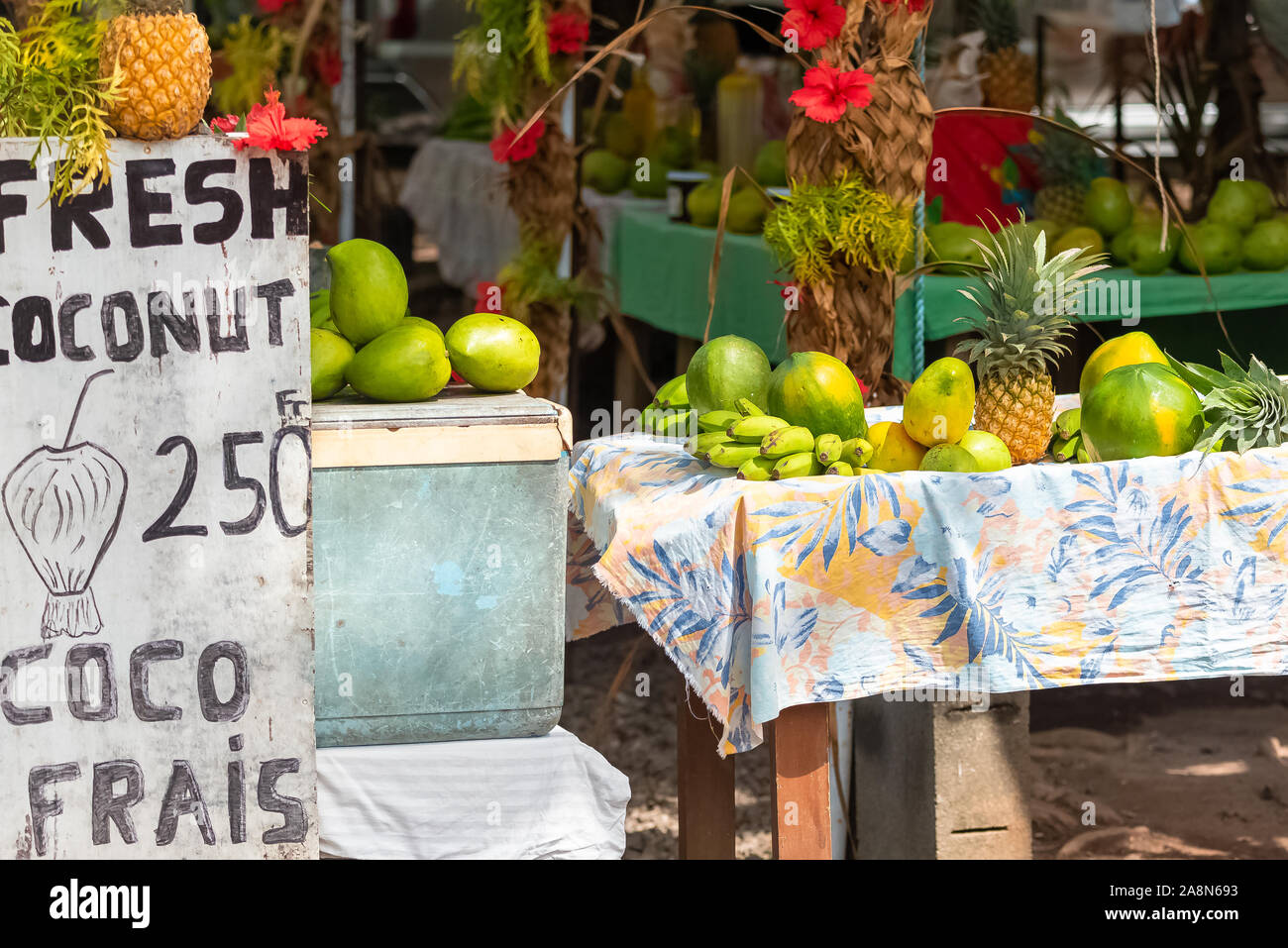 Exotic fruits sold on the road, market stall, street hawker in French Polynesia, Moorea Stock