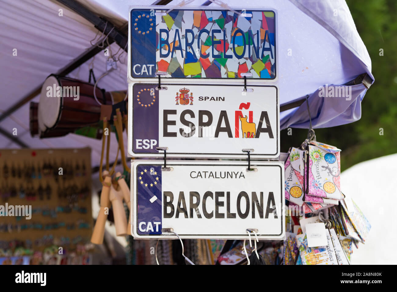 BARCELONA, SPAIN - OCTOBER 21, 2019: Politically tinted name plates of spain and barcelona on the famous ramblas, the most touristic spot to be in the Stock Photo
