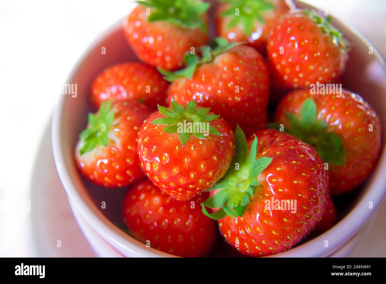 Strawberries and cream in a bowl hi-res stock photography and images ...