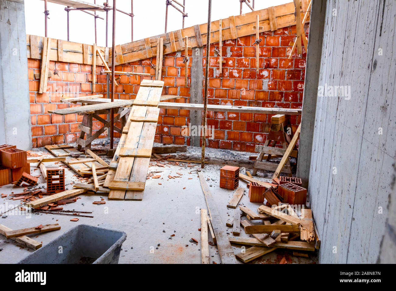 Residential building is under construction, unfinished with red blocks