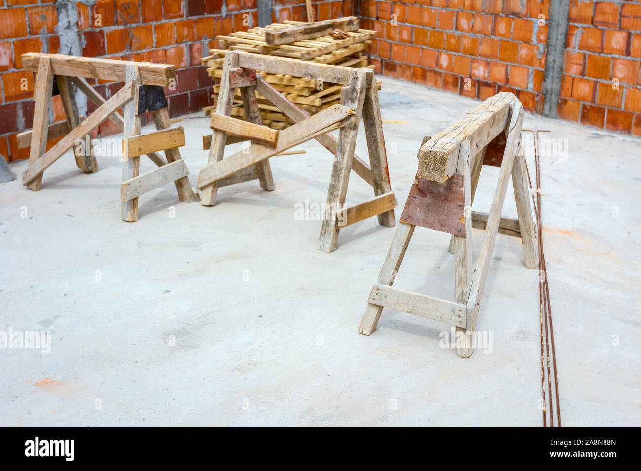 Wooden frame truss made of beams for mobile scaffold at building site, under construction. Stock Photo