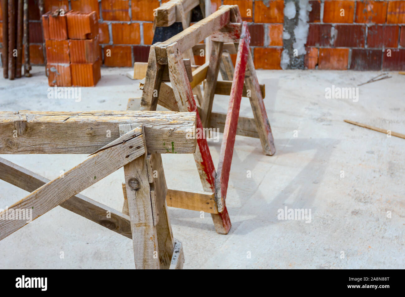 Wooden frame truss made of beams for mobile scaffold at building site, under construction. Stock Photo