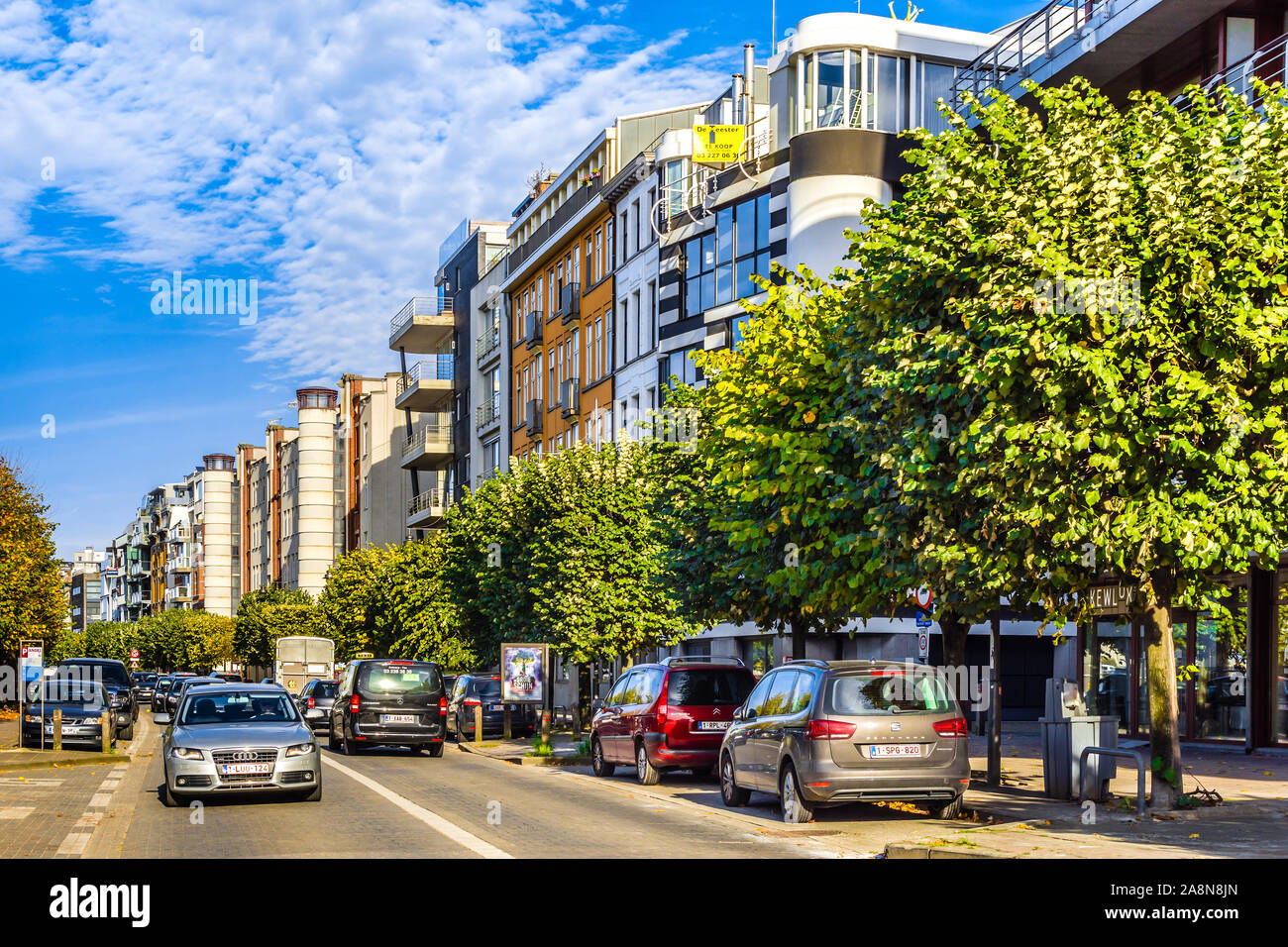 View along street between private apartment blocks and Scheldt waterway