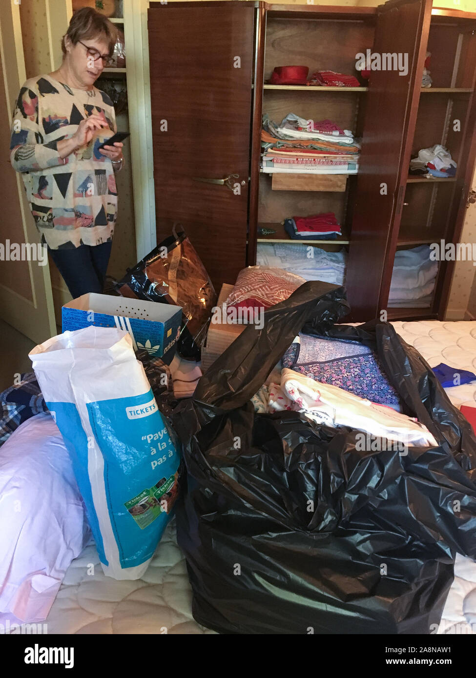 Cleaning out dead person's effects, Lyon, France Stock Photo Alamy