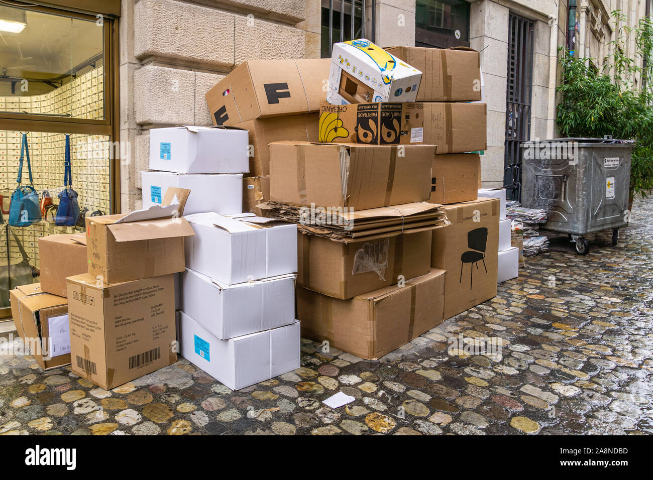 Cardboard boxes stacks or piles in the street ready to be collected by the  municipality, Basel, Switzerland Stock Photo - Alamy