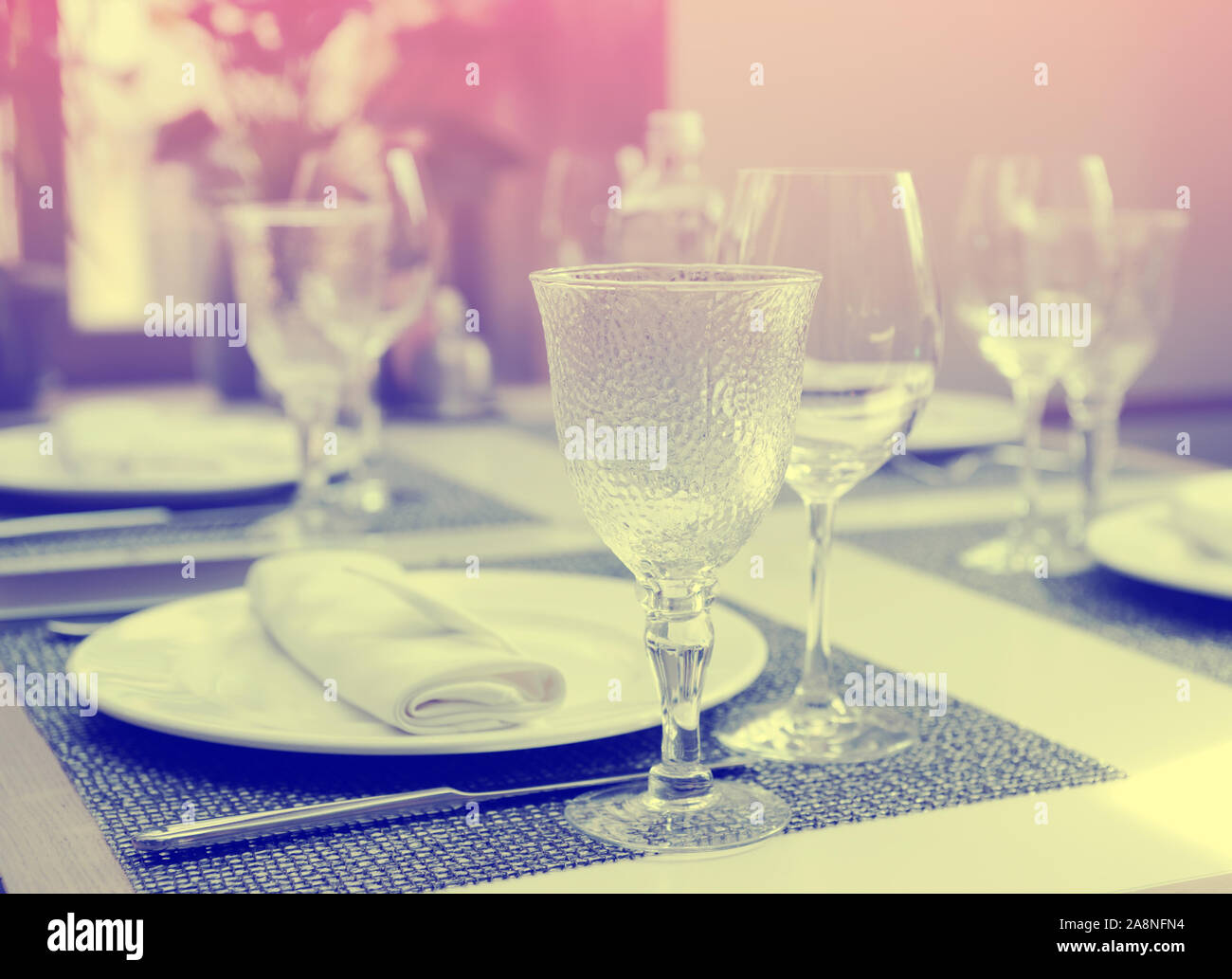 Nice place setting in an expensive restaurant, toned image Stock Photo