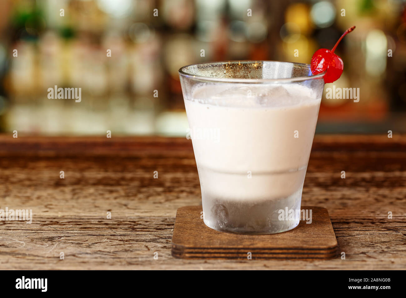 Milkshake with vodka is on the bar in the nightclub. Drinks party. Stock Photo