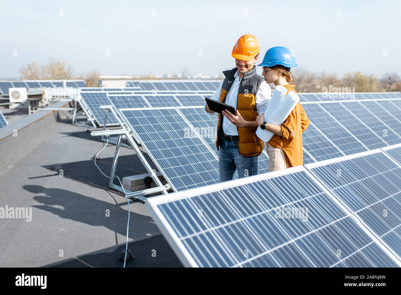 Two engineers or architects examining the construction of a solar power