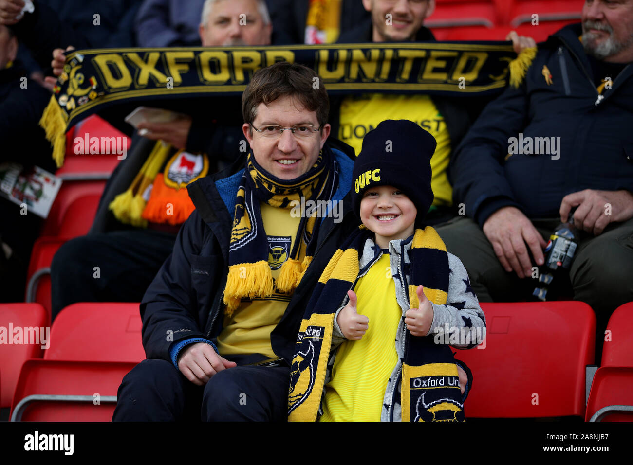 Oxford United fans during the FA Cup First Round match at the SKYEx Community Stadium, London. Stock Photo