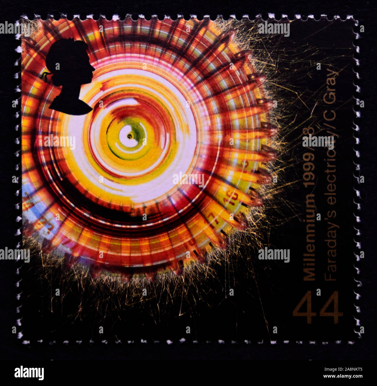 Postage stamp. Great Britain. Queen Elizabeth II. Millennium Series. The Scientist's Tale. Rotation of Polarized Light by Magnetism (Faraday's work). Stock Photo