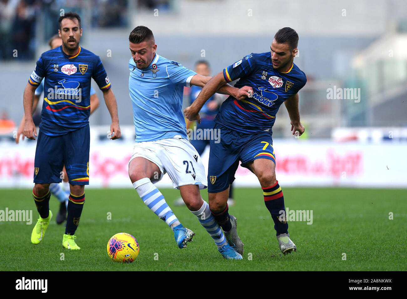 Rome, Italy. 10th Nov, 2019. Sergej Milinkovic-Savic of SS Lazio is challenged by Panagiotis Tachtsidis of US Lecce during the Serie A match between Lazio and Lecce at Stadio Olimpico, Rome, Italy on 10 November 2019. Photo by Giuseppe Maffia. Credit: UK Sports Pics Ltd/Alamy Live News Stock Photo