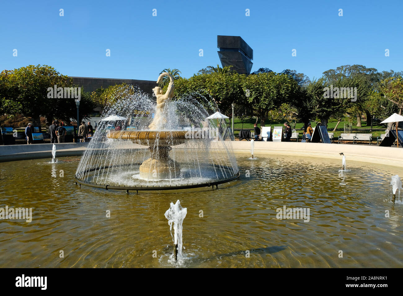 Rideout Memorial Fountain at the Golden Gate Park Music Concourse in San Francisco, California on a sunny autumn day; cat wrestling a snake. Stock Photo