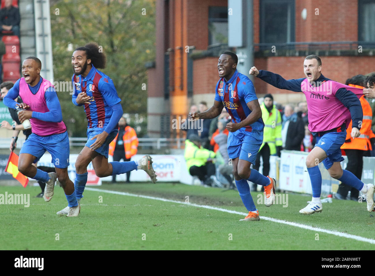 London, UK. 10th Nov, 2019. LONDON UNITED KINGDOM. NOVEMBER 10 The Maldon and Tiptree bench celebrate their win during The FA Cup First Round between Leyton Orient and Maldon and Tiptree at Brisbane Road, London, England on 10 November 2019 Credit: Action Foto Sport/Alamy Live News Stock Photo