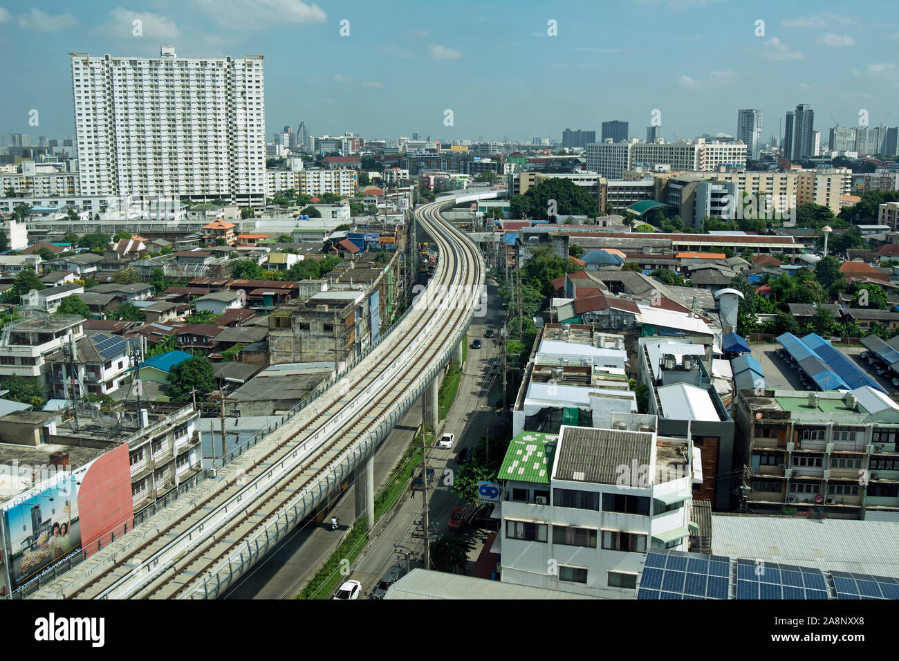 high view across the bang phlat area of bangkok with the tracks of the elevated mass transit system known as skytrain in the foreground Stock Photo