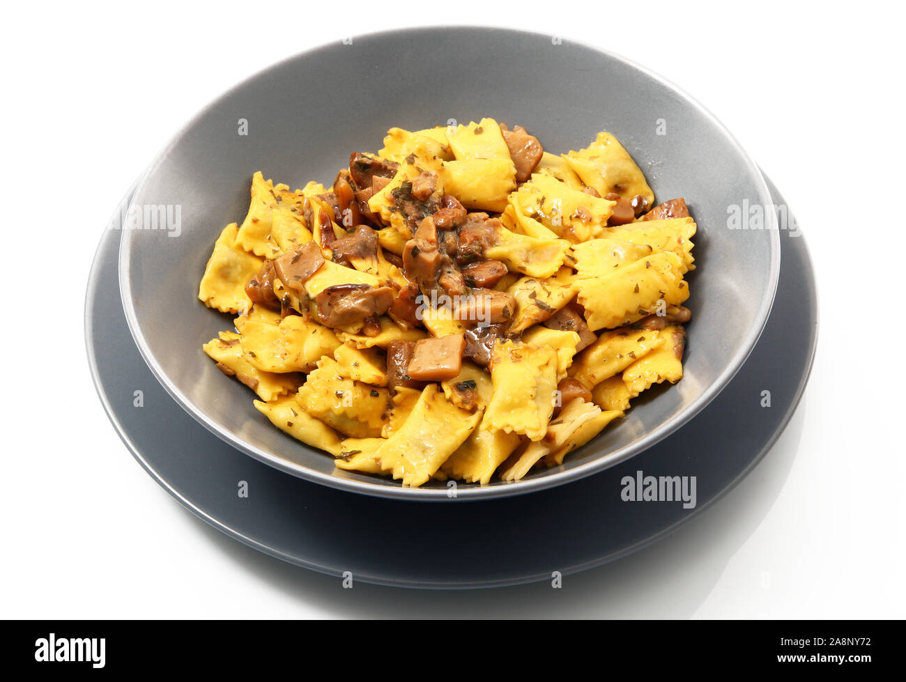 italian ravioli pasta with mushroom on white background Stock Photo - Alamy