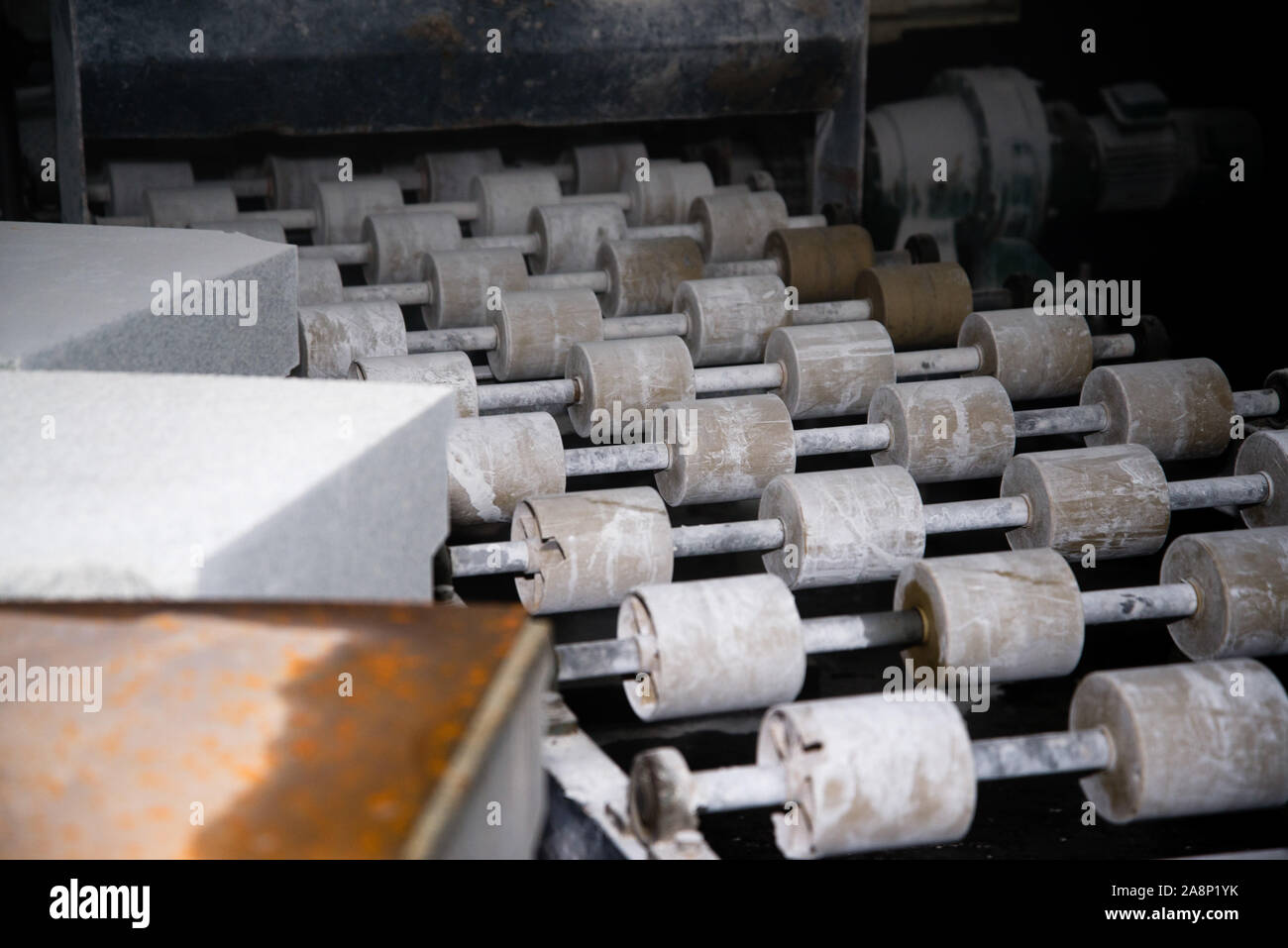 Conveyor on the grinding machine. Rollers on the rolling mill Stock