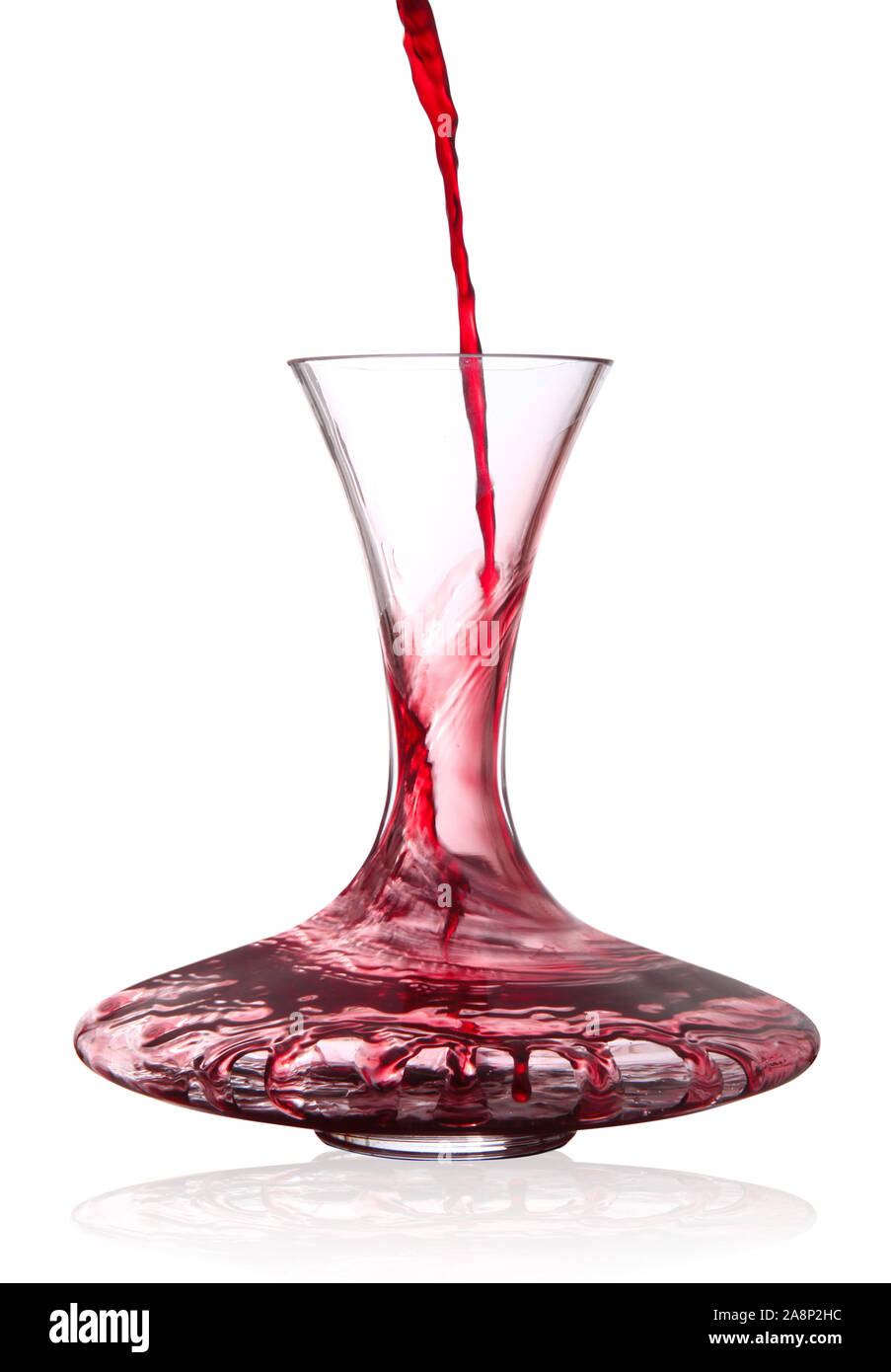 Decater Red wine poured into decanter on white background Stock Photo - Alamy