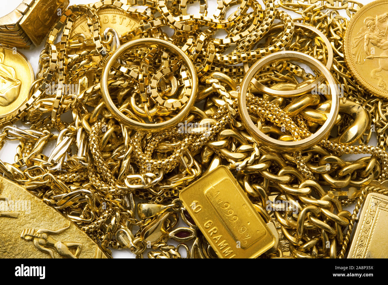 precious gold objects on white background Stock Photo Alamy