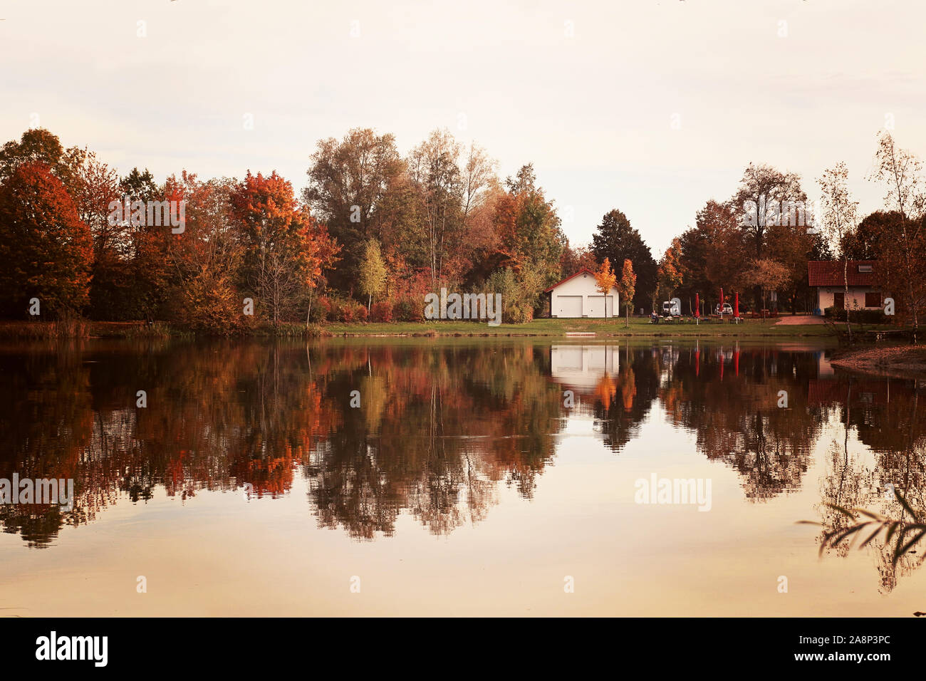 Badeweiher small lake near Finsing - Upper Bavaria -  in autumn, quiet and idyllic waters like a mirror Stock Photo
