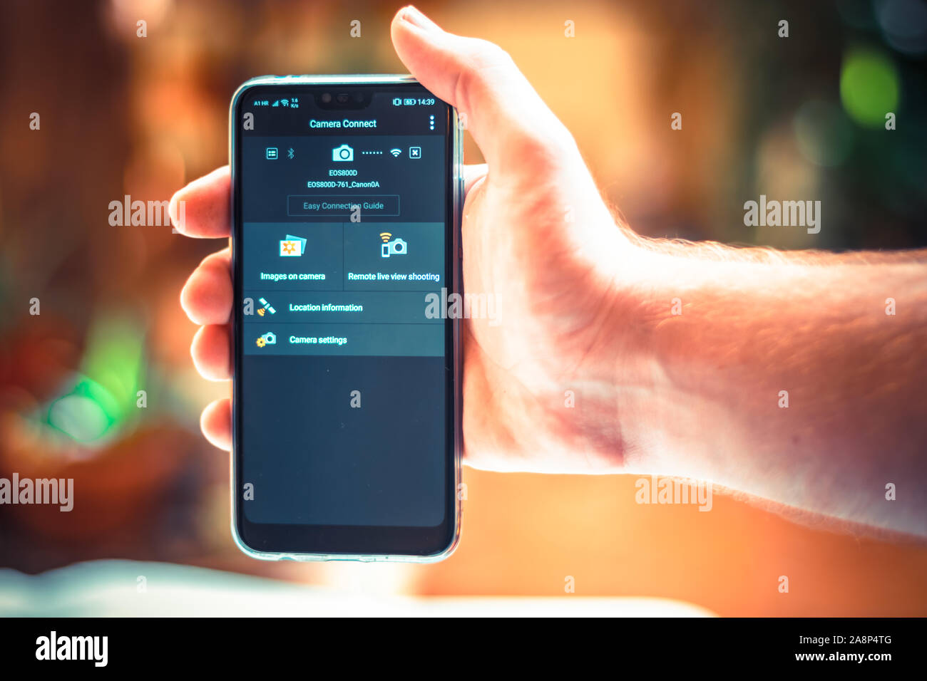 Person Holding A Smartphone With Canon Camera Connect Open Remote Control App From Canon For Controlling Dslr And Mirorrless Cameras Stock Photo Alamy Person Holding A Smartphone With Canon Camera Connect Open Remote Control App From Canon For Controlling Dslr And Mirorrless Cameras Stock Photo Alamy