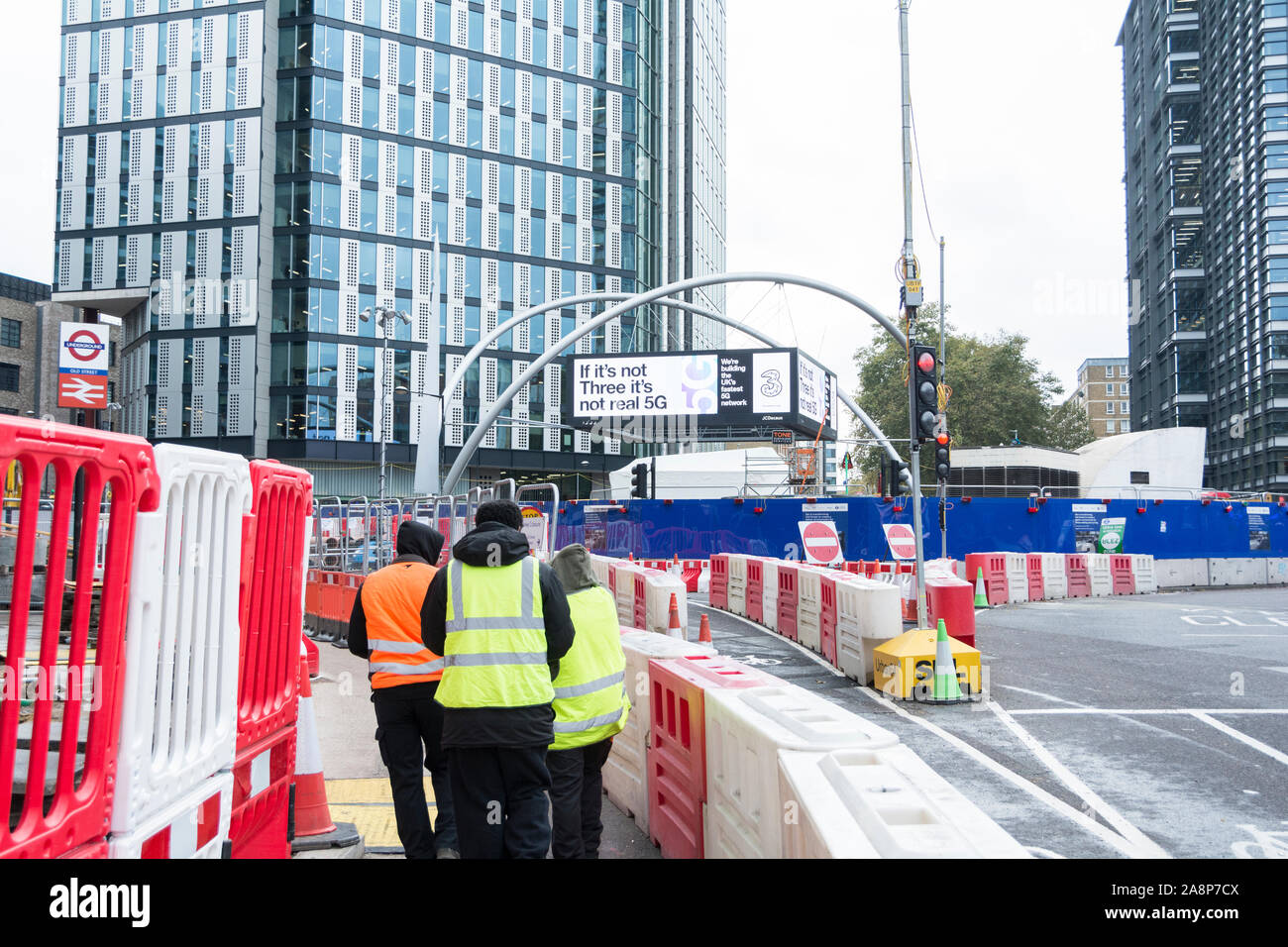 Workmen and roadworks on Old Street, Roundabout, London, UK Stock Photo