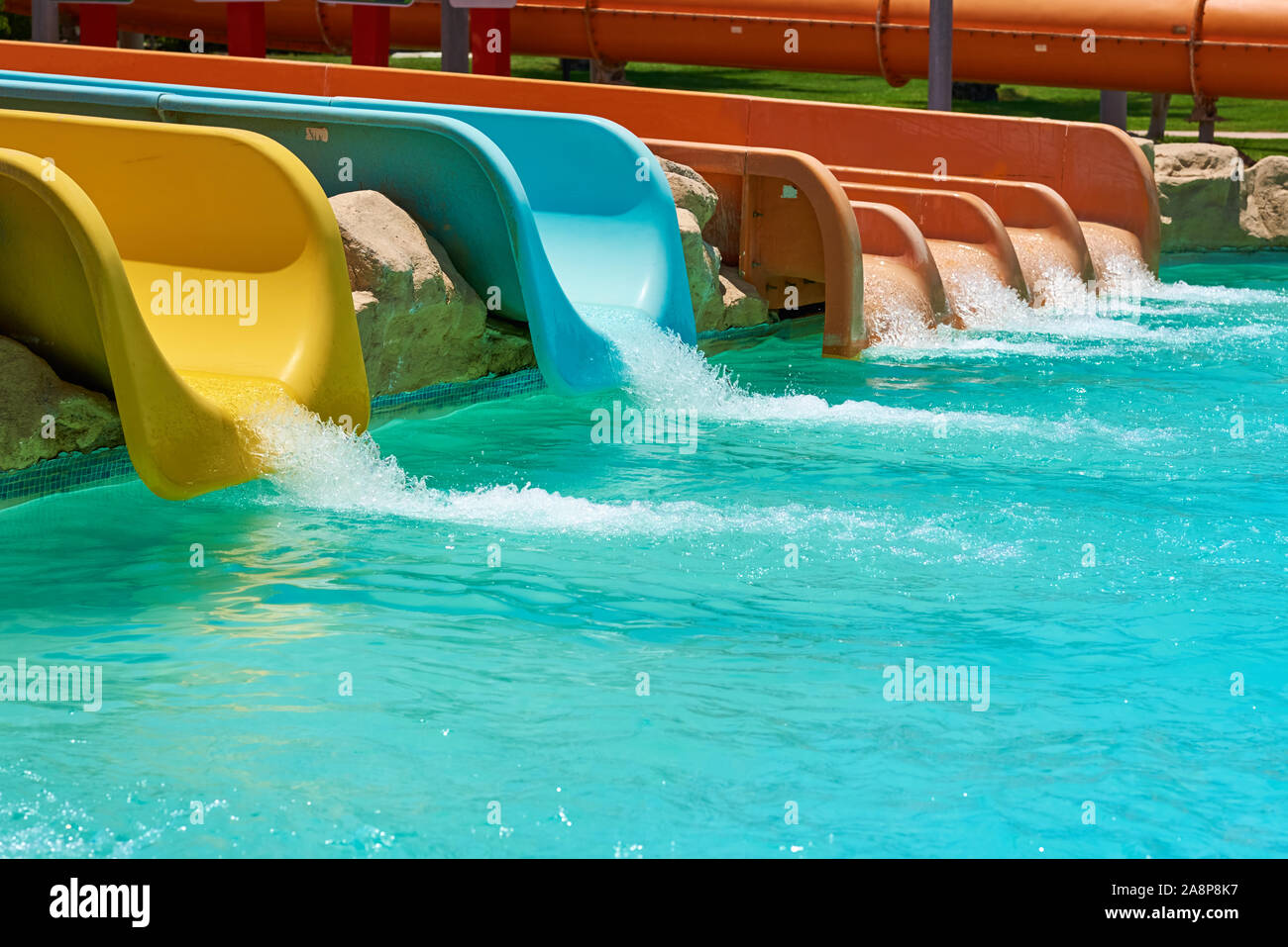 Colorful water slides in aqua park, close up Stock Photo