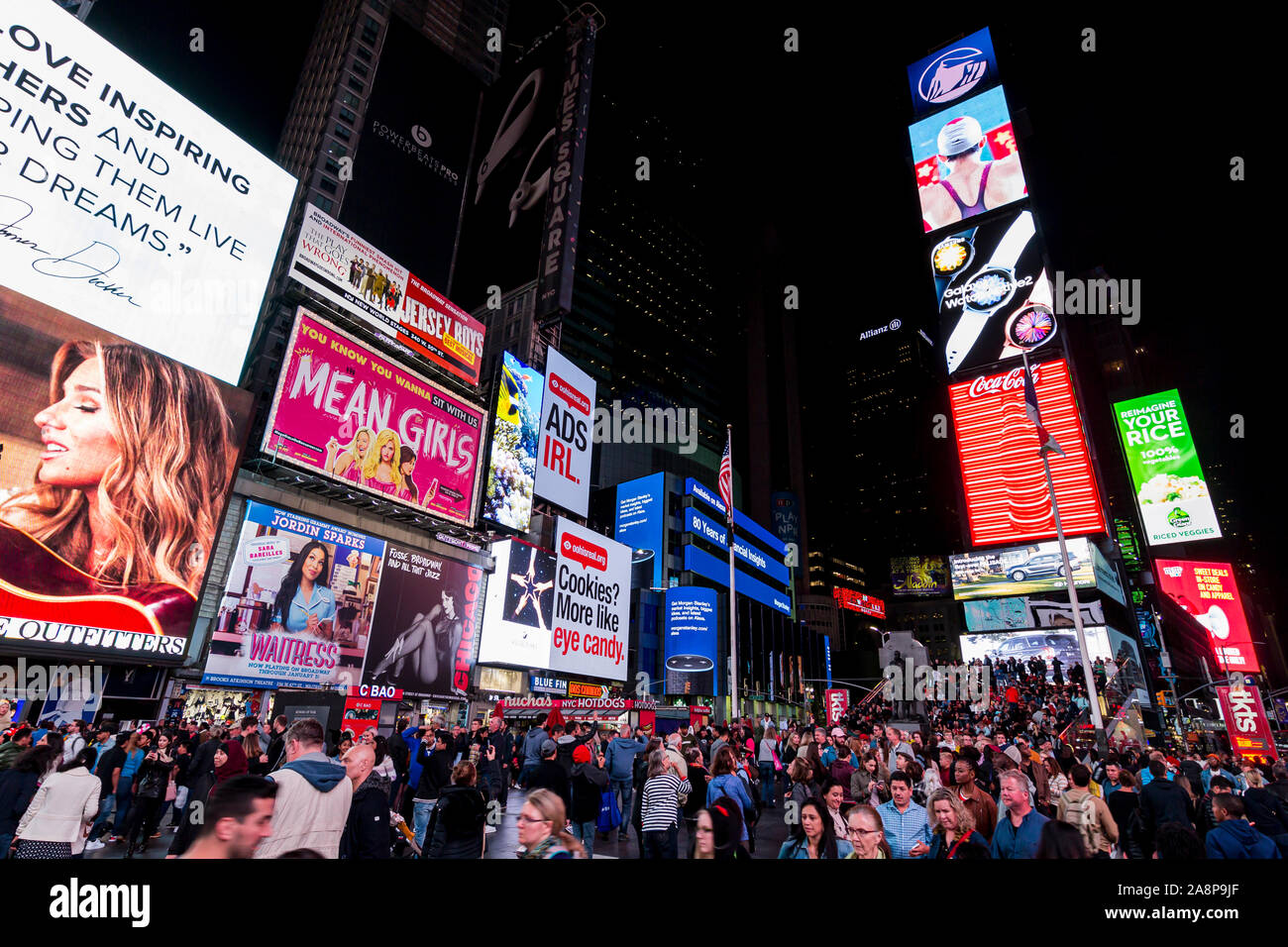 Times Square, a busy and crowded intersection in Manhattan, with many neon ads in an iconic street of Stock Photo