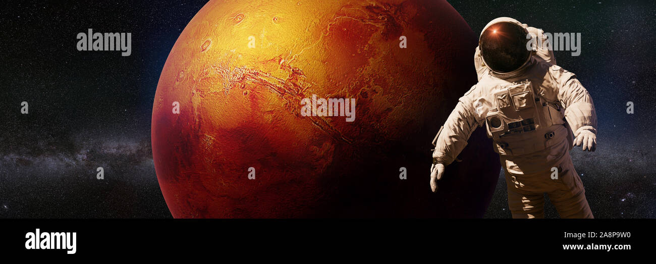 astronaut during a space walk in orbit of planet Mars Stock Photo - Alamy