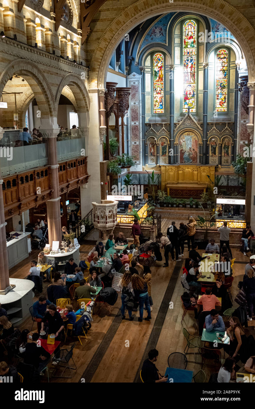 Mercato Mayfair, new food market recently opened in restored historic church St Mark's in Mayfair London UK. Photo shows food stalls in the main hall. Stock Photo