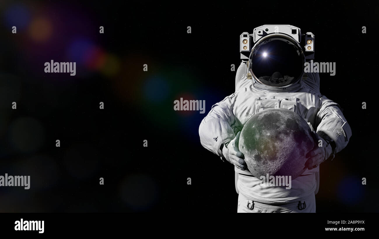 astronaut holding the Moon Stock Photo