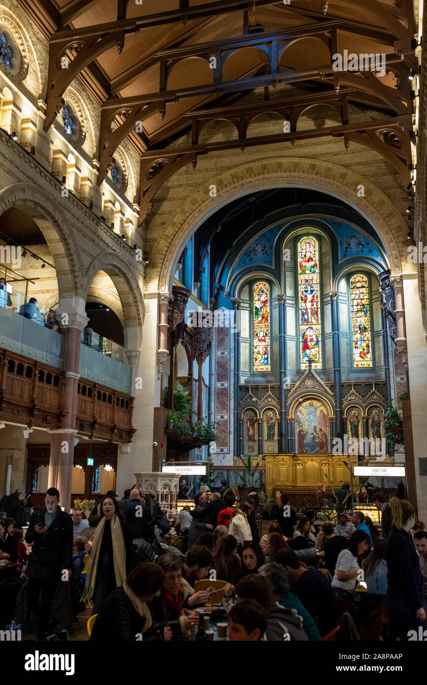 Mercato Mayfair, new food market recently opened in restored historic church St Mark's in Mayfair London UK. Photo shows food stalls in the main hall. Stock Photo