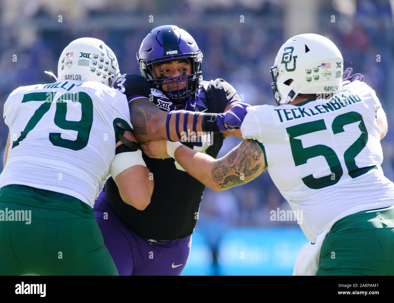 November 9 2019: TCU Horned Frogs defensive tackle Izaih Filikitonga (43) rushes against Baylor Bears offensive lineman Sam Tecklenburg (52) and Baylor Bears offensive lineman Casey Phillips (79) during the 1st half of the NCAA Football game between Baylor Bears and the TCU Horned Frogs at Amon G. Carter stadium in Fort Worth, Texas. Matthew Lynch/CSM Stock Photo
