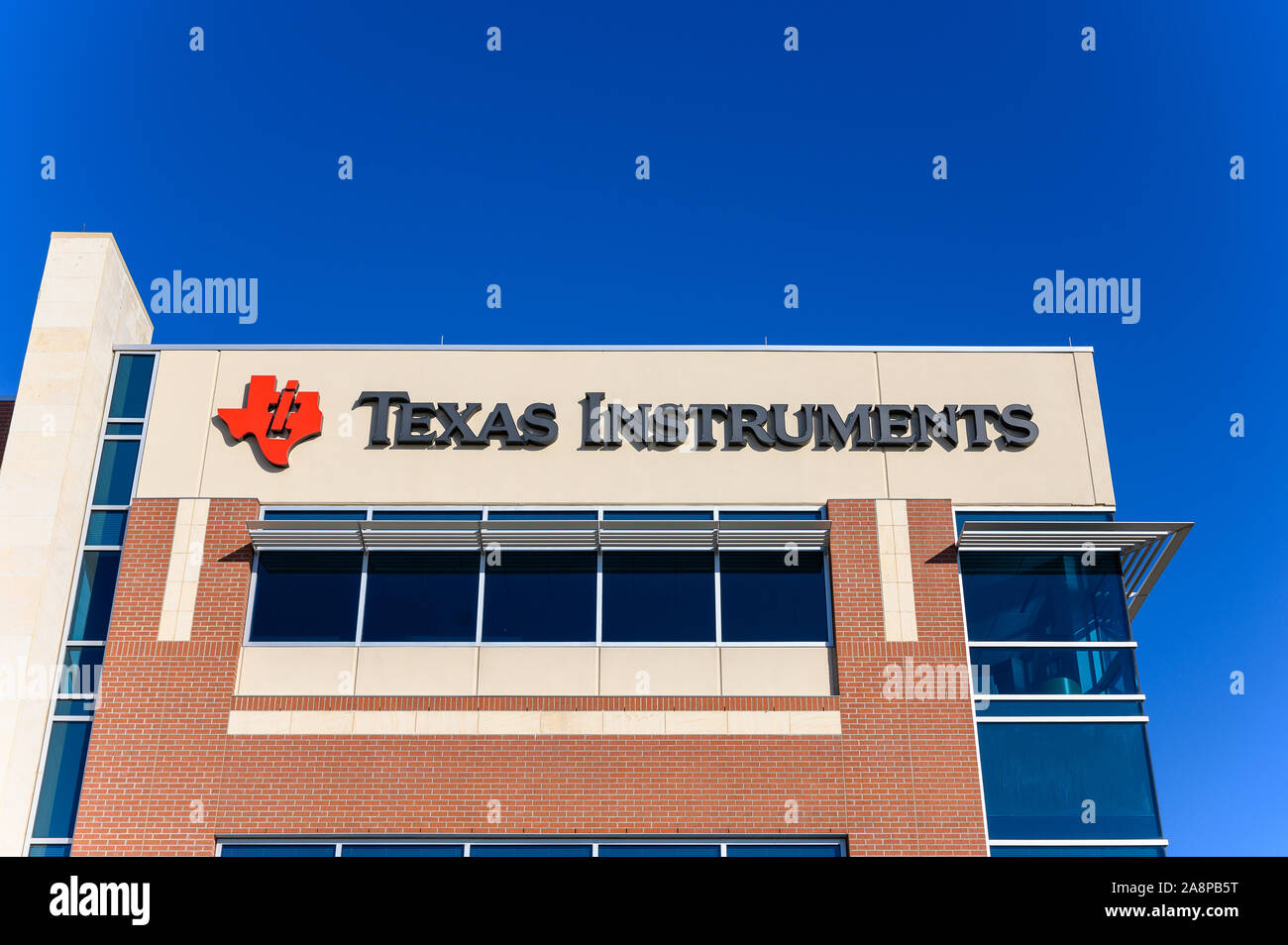 Sugar Land, Texas - Nov 9, 2019: Texas Instruments Sugar Land Facility. TI is an American technology company that designs and manufactures semiconduct Stock Photo