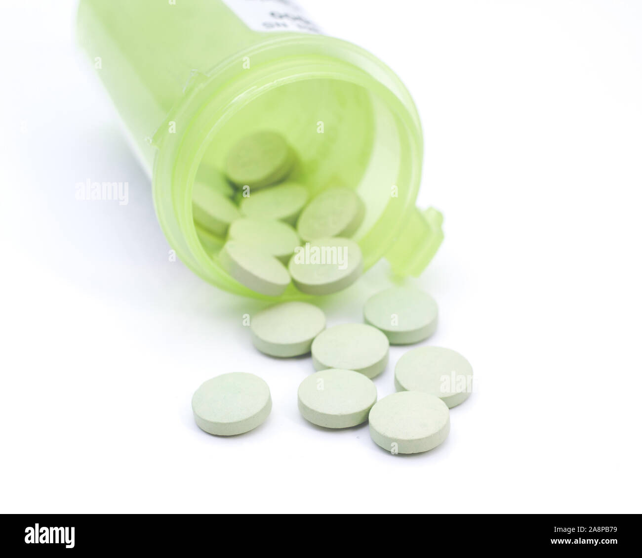 Prescription pills and bottle on white. Stock Photo