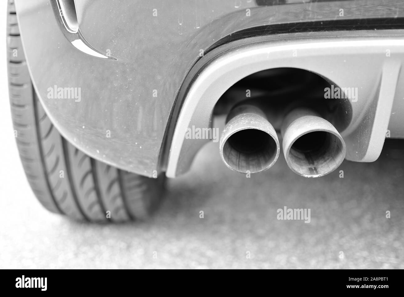 Exhaust of a luxury car with two exhaust pipes Stock Photo Alamy