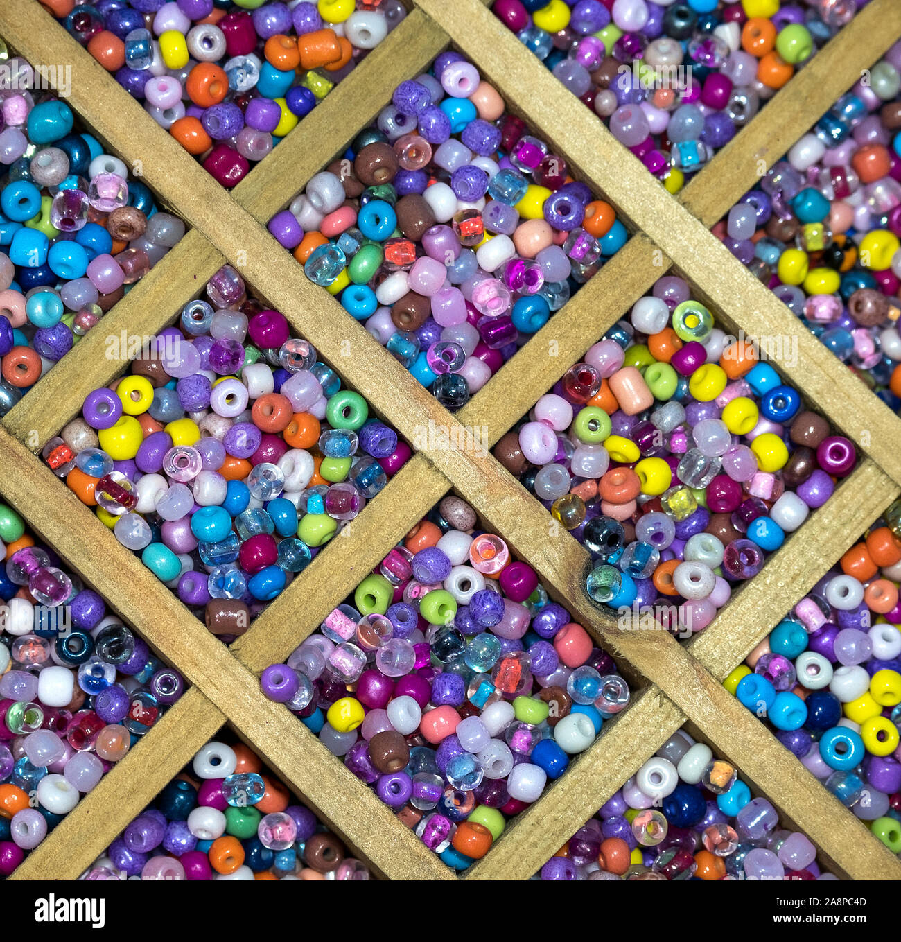 Coloured micro beads in boxes Stock Photo Alamy
