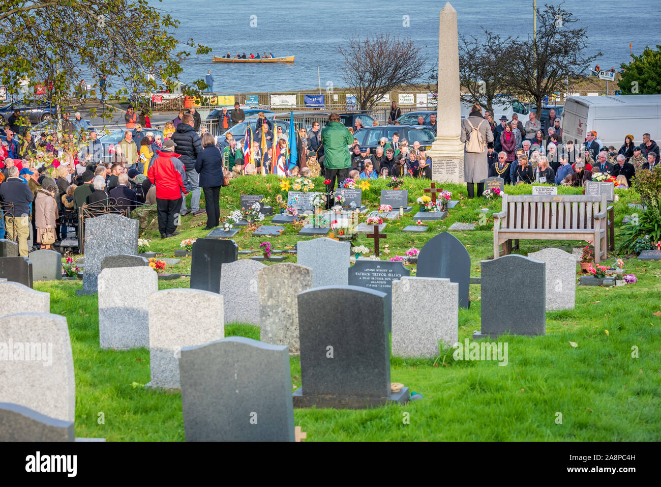 Appledore, North Devon, UK. Sunday 10th November 2019. UK Weather. Sunshine and a gentle breeze on Remembrance Sunday in North Devon. The community gathers as wreaths are laid on the Appledore village war memorial on Remembrance Sunday. Terry Mathews/Alamy Live News. Stock Photo